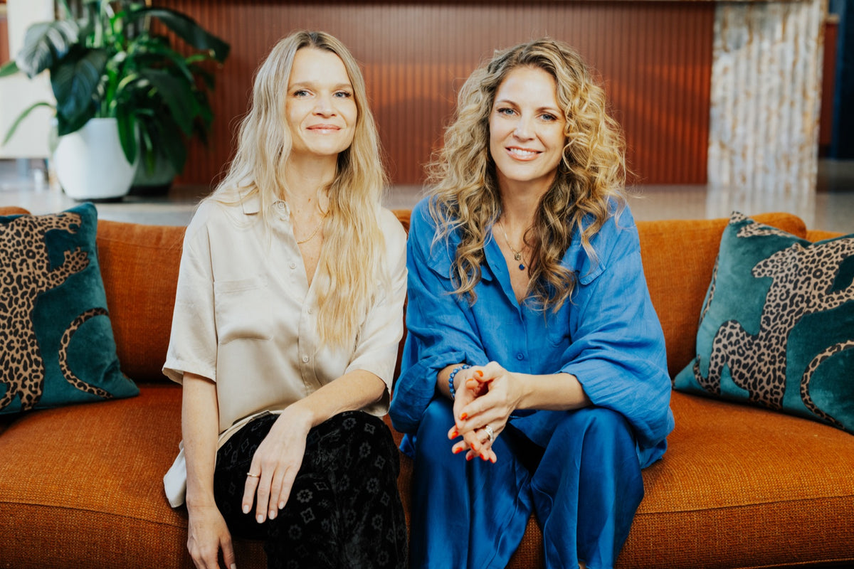 Zoe and Jem, laughing on the clinic couch