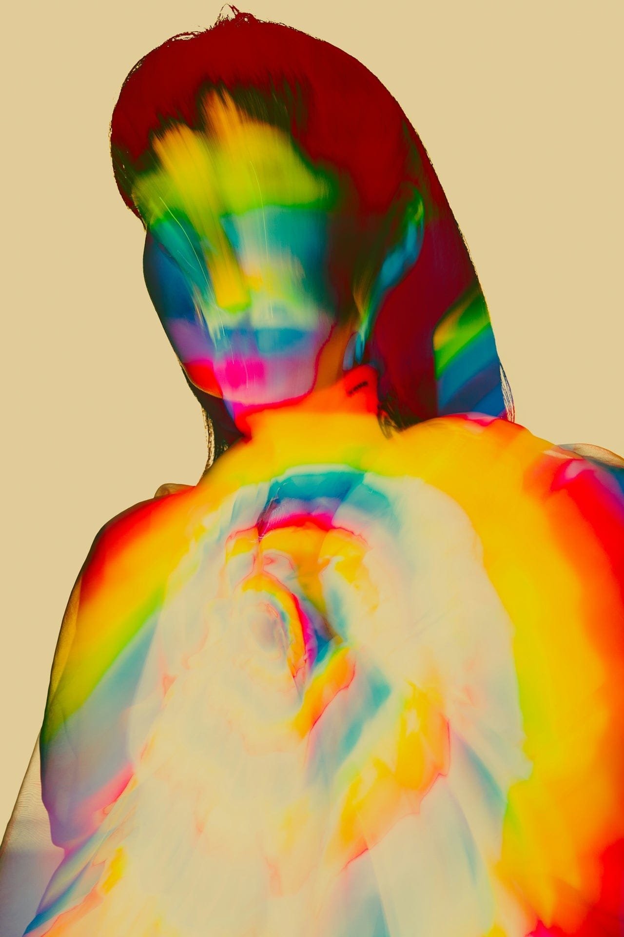 Rainbow-hued double exposure of a woman from behind, cover image for nervous system dysregulation