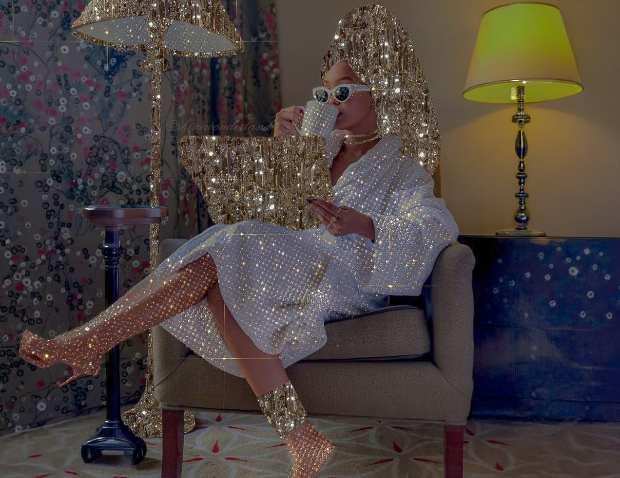 Woman in a white robe surrounded by gold sequins sipping tea, cover image for the new currency of leadership
