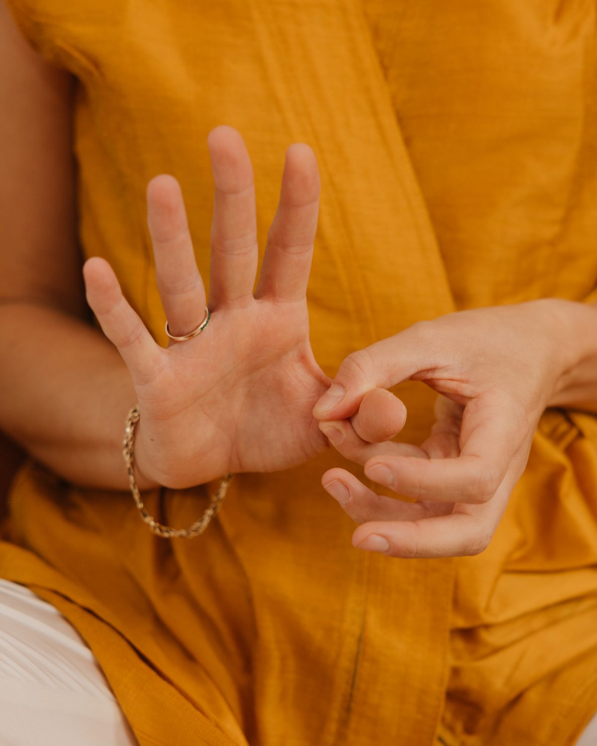 A practitioner's hands at work in a Specialised Kinesiology session